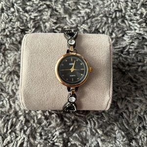 KMS black and gold watch